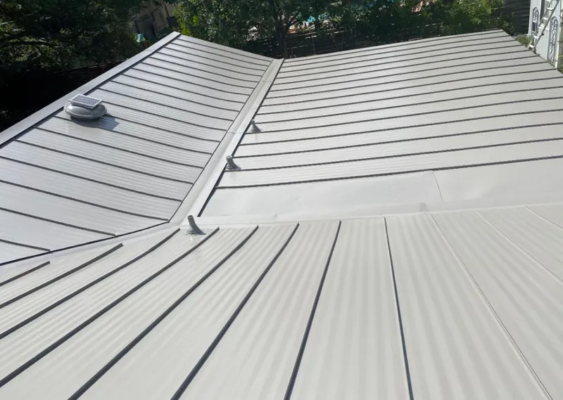 Solar attic fan installed on a metal roof for Roof Ventilation in Spartanburg
